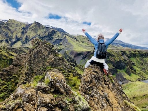 Image of a woman on a mountaintop having a celebration of life in an unusual location