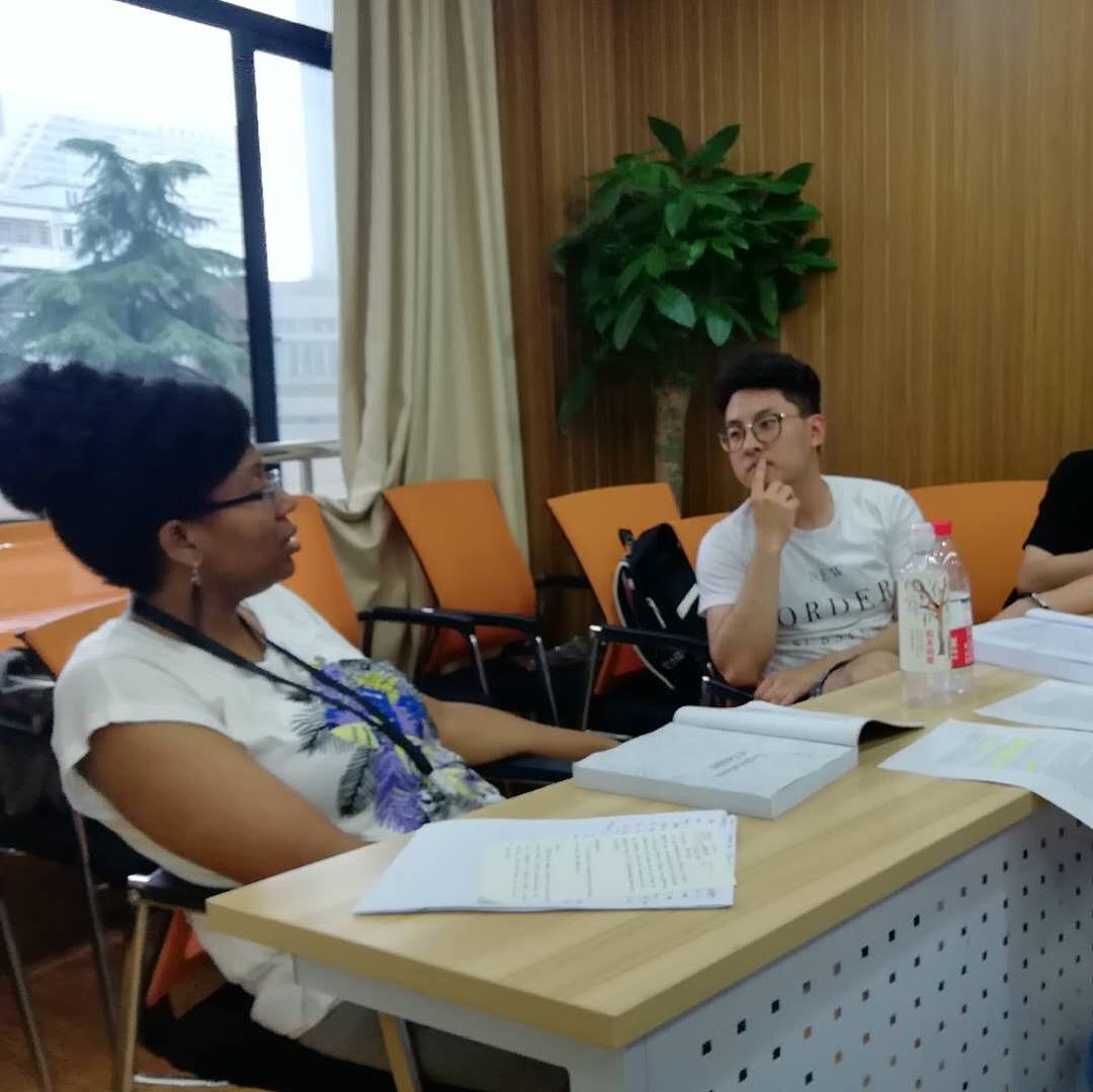 Dr. Kami Fletcher speaking with a student