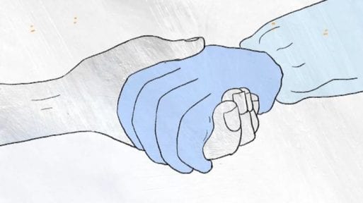 Gloved hand holding a bare hand 