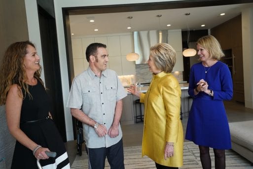 Kisa Heyer, CEO of the Dream Foundation, with Hillary Clinton and an adult wish recipient.