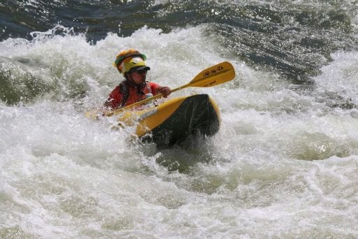Louis Chinn navigates the rapids in a persona kayak.