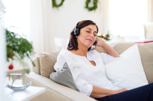 Image of someone listening to a playlist made in memory of someone who has died