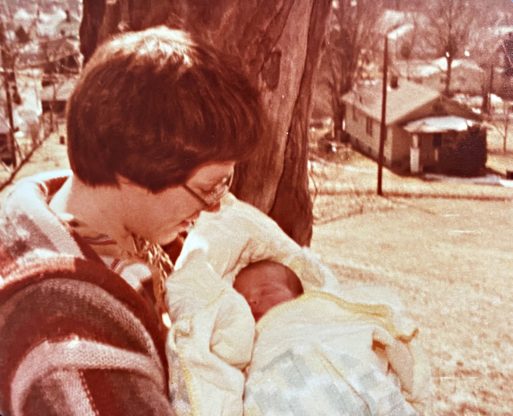 My mother holds me as a newborn seven years before my mother died