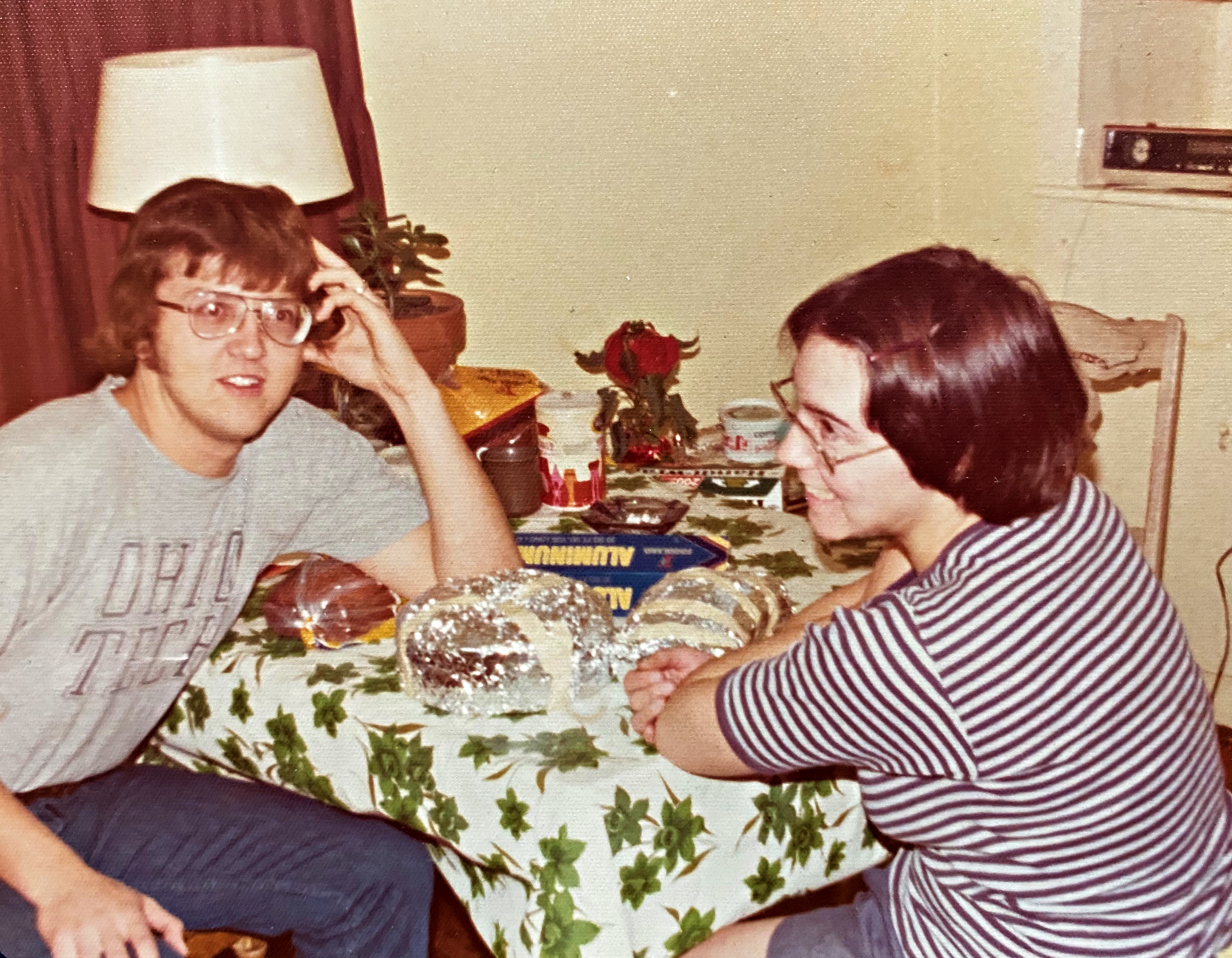 My parents are happy while sitting at a table before my mother died