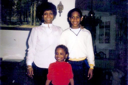 Childhood photo of Kandi, brother Patrick, and mother