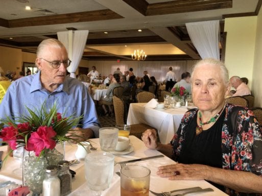 image of elderly couple having dinner and discussing dementia and rational suicide 
