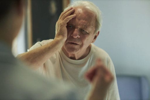 Anthony Hopkins holds a hand to his head in a moment of confusion in "The Father."
