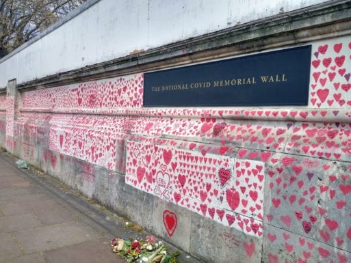 covid memorial wall covered with hearts