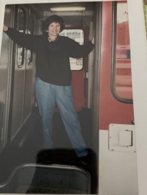 Mary Jane Mann poses on a train in Europe, prior to suffering guardian abuse.