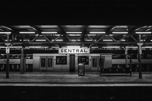Black and white photo of empty train station evokes the poem Notes on the Existence of Ghosts