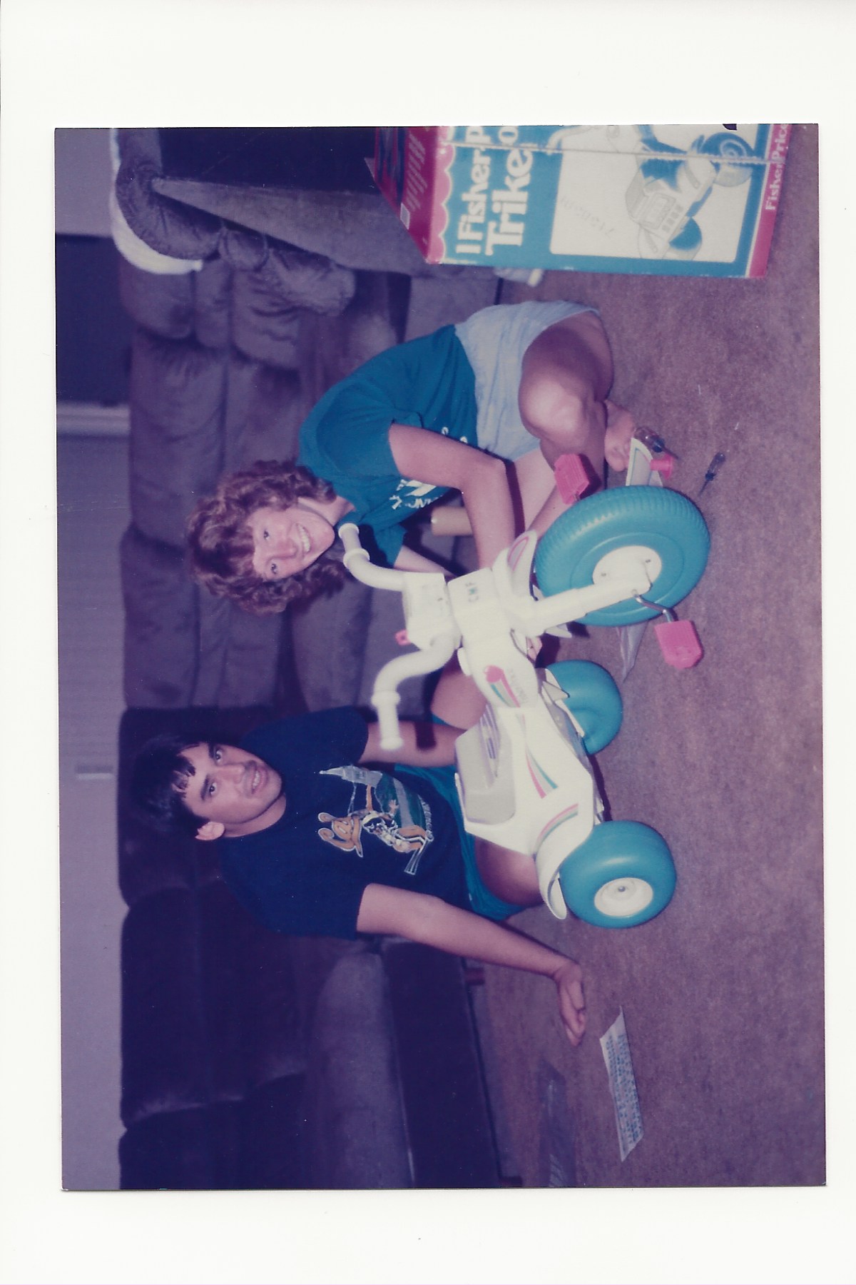 Sue putting together a Big Wheel for one of my kids showing the generosity that gave me comfort after tragedy