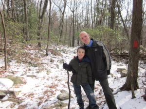 photograph of end-of-life options advocate thaddeus pope with son finn in snowy woods