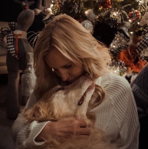woman hugs her dog in end-of-life pet photograph