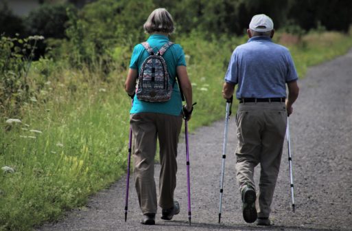 Two seniors go on a nature walk
