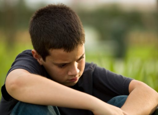 Young boy grieving like Armstrong did when he wrote the song "Wake Me Up When September Ends