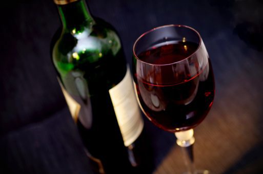 bottle and glass of red wine in palliative care