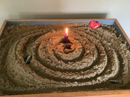 A sand tray in which Yockey has done sandplay.