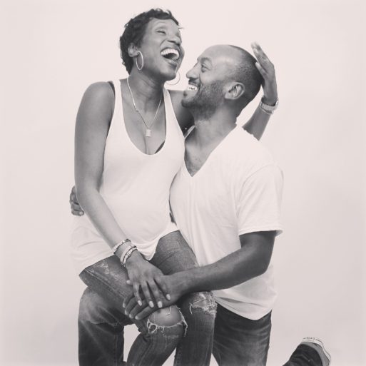 Black couple embracing in laughter