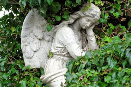 angel sculpture in graveyard depicts keeping pain private