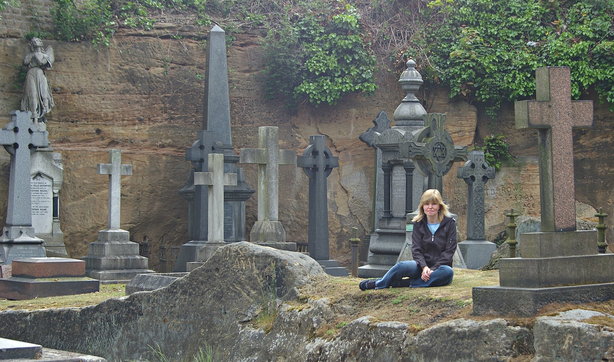 headstone hunter sits in a cemetery