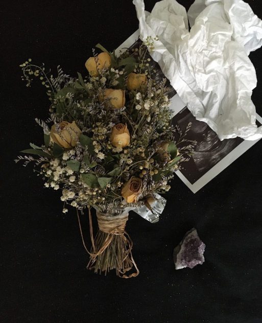a bouquet of dried roses reflecting baby loss
