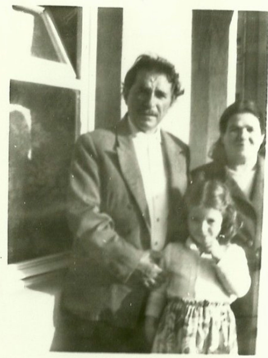Family portrait of grandfather, grandmother and granddaughter