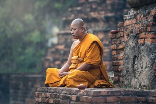 Buddhist monk meditates on how we live is how we die