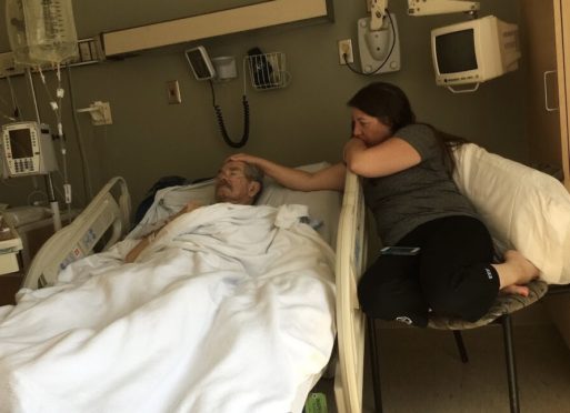 Julia with her father shows hospice massage and touch at the end of life 