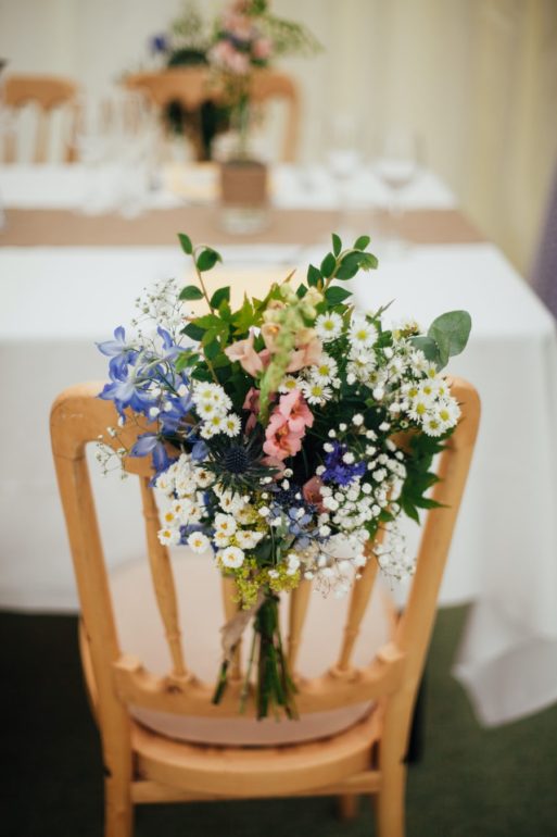 A saved seat with flowers at a celebration of life