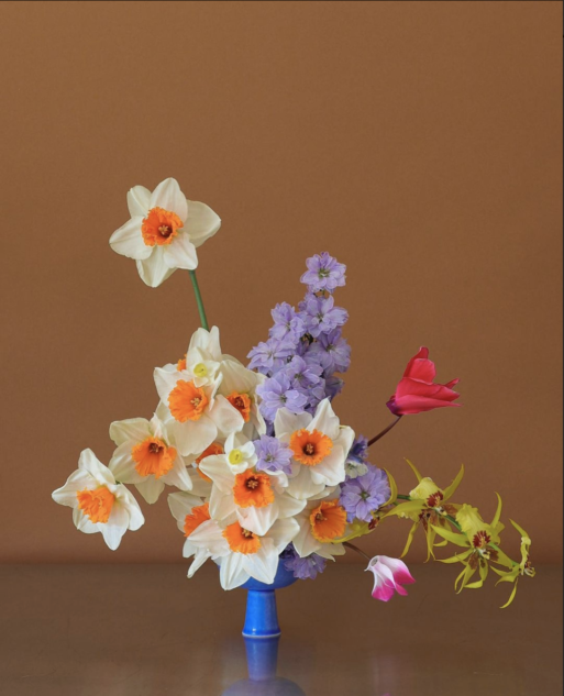 Beautiful bouquet of daffodils and colorful stems is a modern spin on memorial flowers
