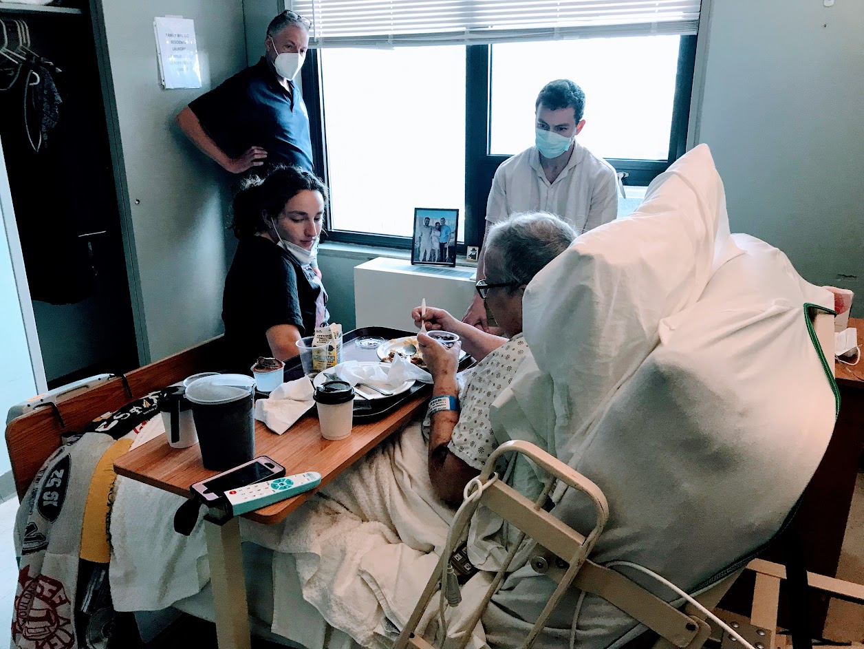 Yip Stool creator, Ian, with his family bedside