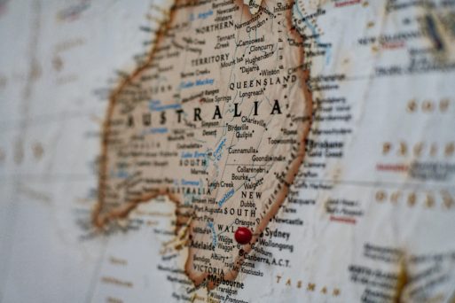 Image of a map of Australia with a red pin stuck into Sydney