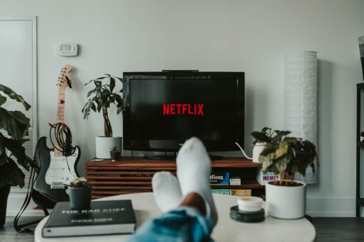 We assume the point of view of someone sitting on their couch in their livingroom with their feet up and crossed on the coffee table in front of a TV projecting Netflix's logo.