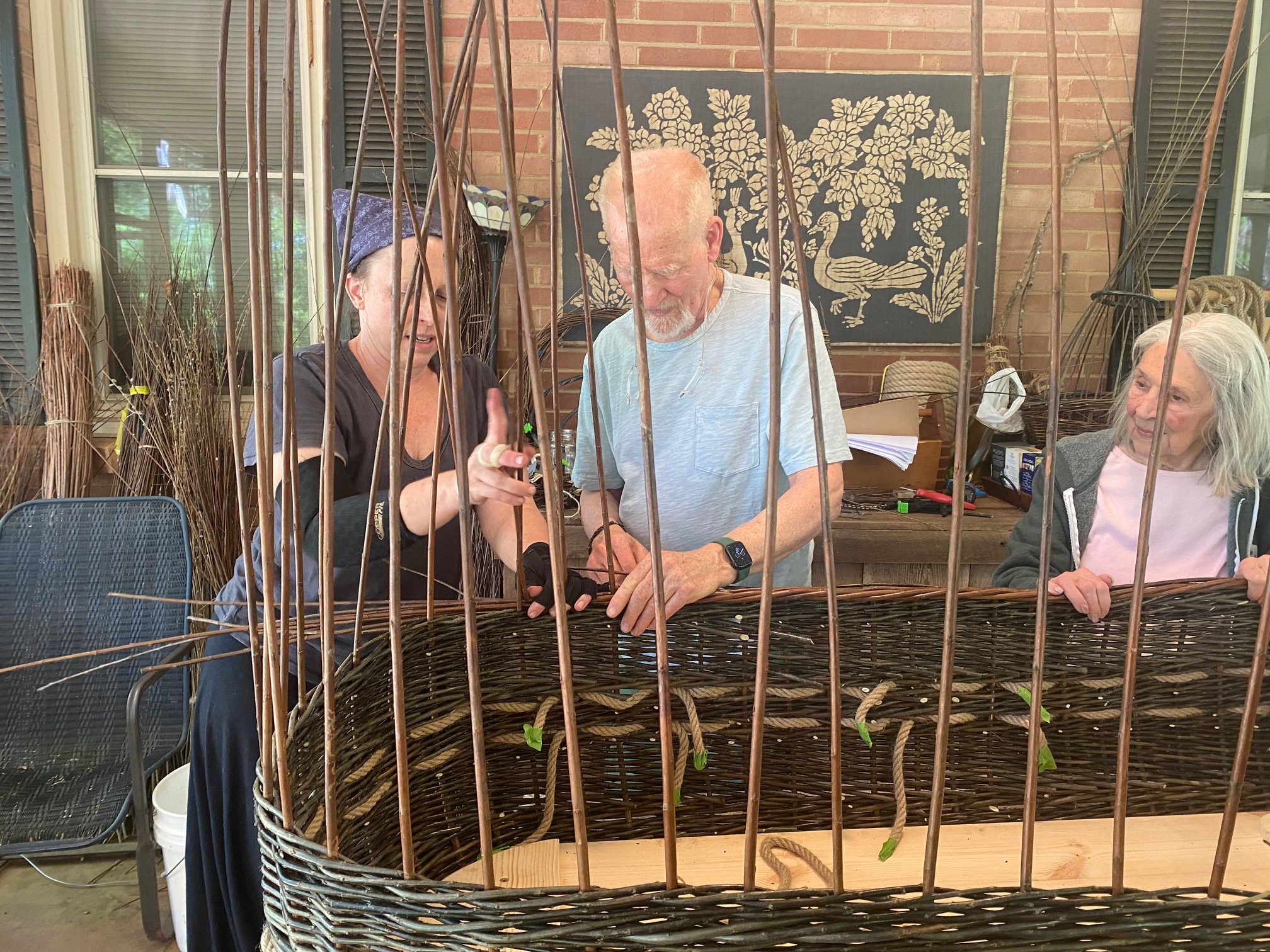 Jack and Nancy weaving burial vessels