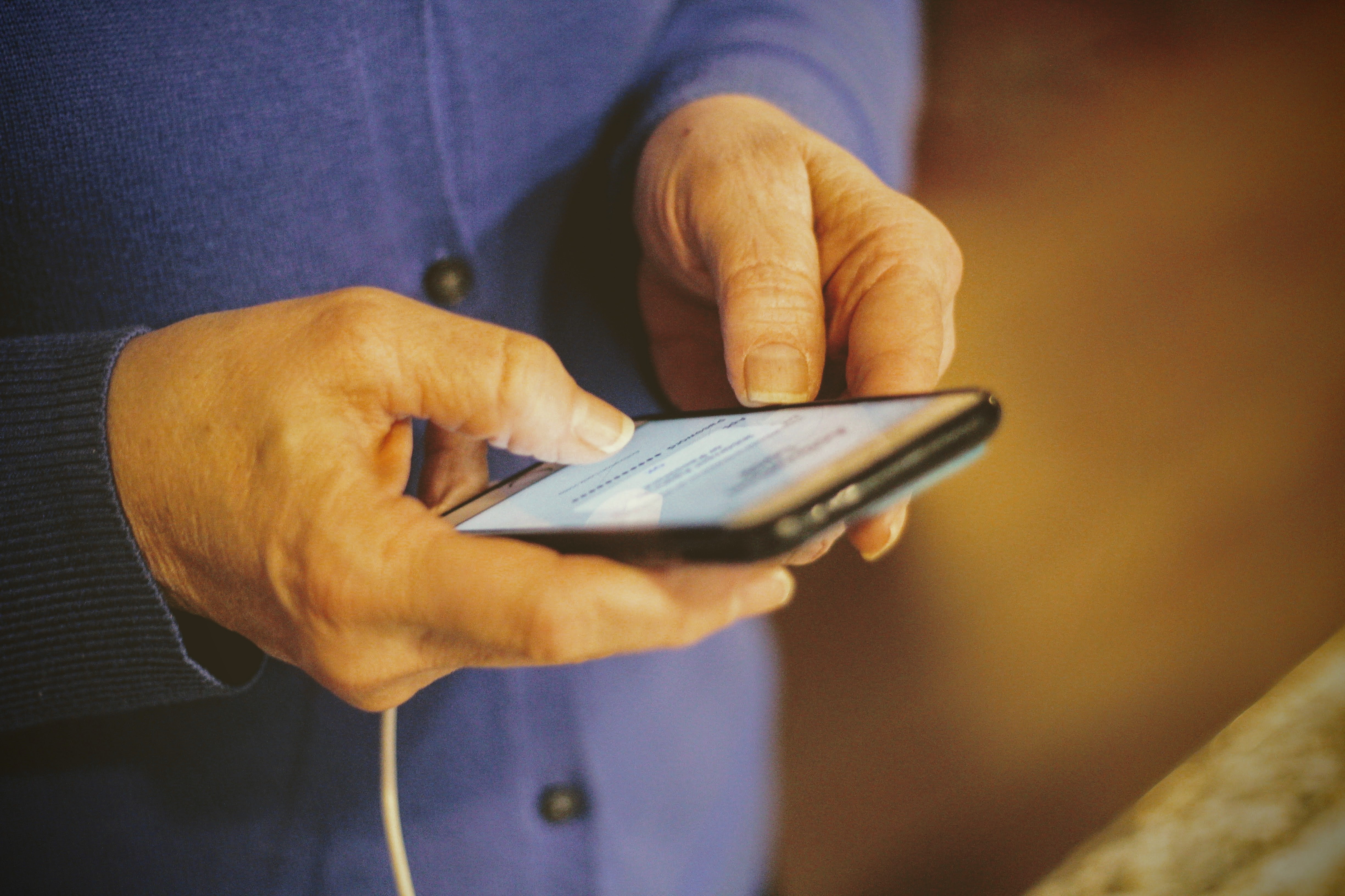 Man checking email on phone last memories of loved one