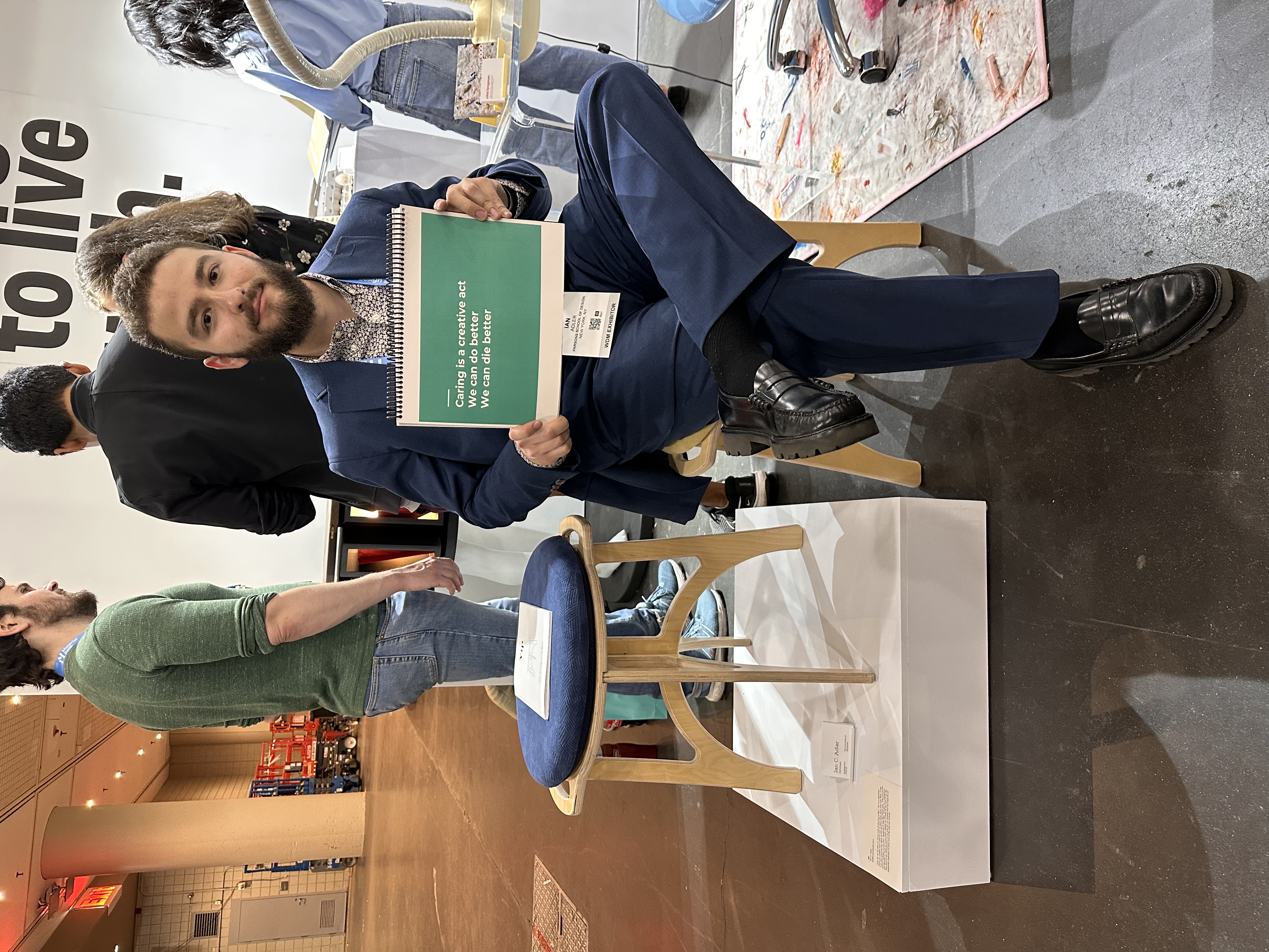 Ian poses with the stool her designed as a tribute to his mother 