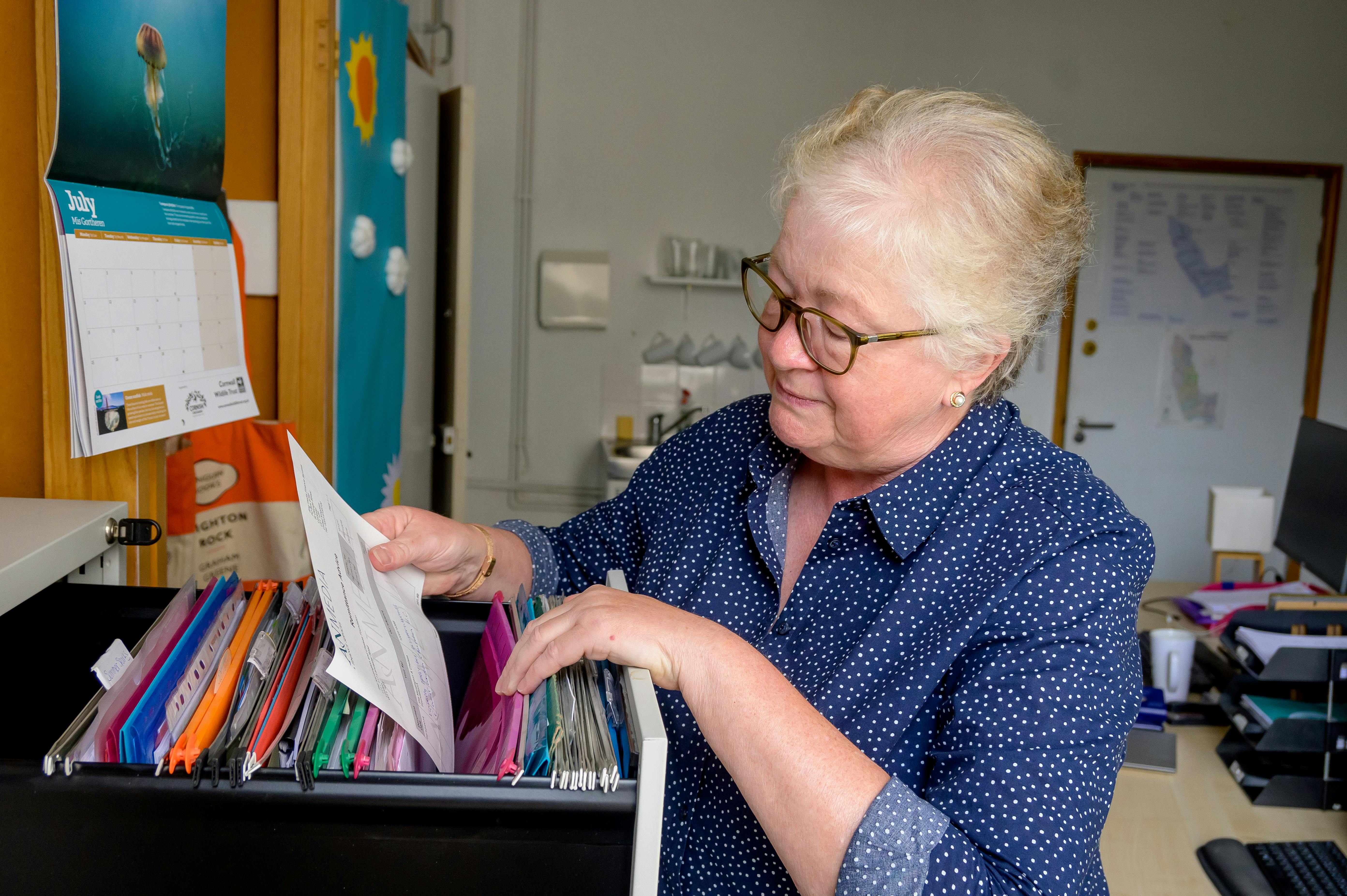 Illustrating older worker in office setting.