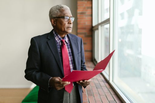 Representing older male worker in an office.