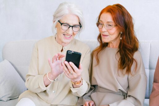 Older women recording a conversation with phone. 