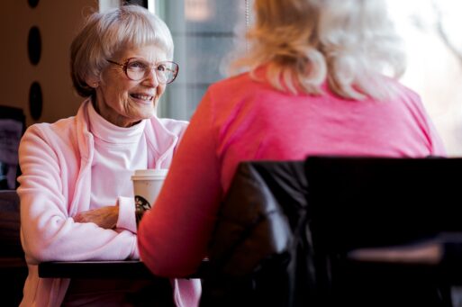 Older women recording a conversation.