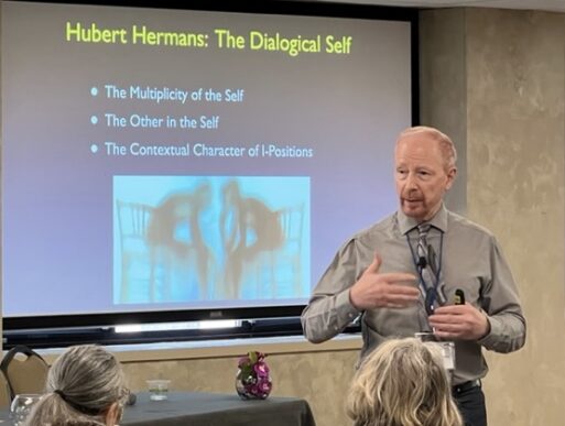 Dr. Neimyer presents at a conference on grief therapy