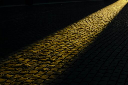 Sunlit brick path representing end of life care path