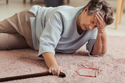 senior woman on floor after falling due to grief clumsiness