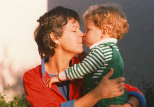 An image of Kay James touching noses with her son, Michael Bishop, when he was a young child. Michael later jumped from the Golden Gate Bridge, which had no suicide barrier.