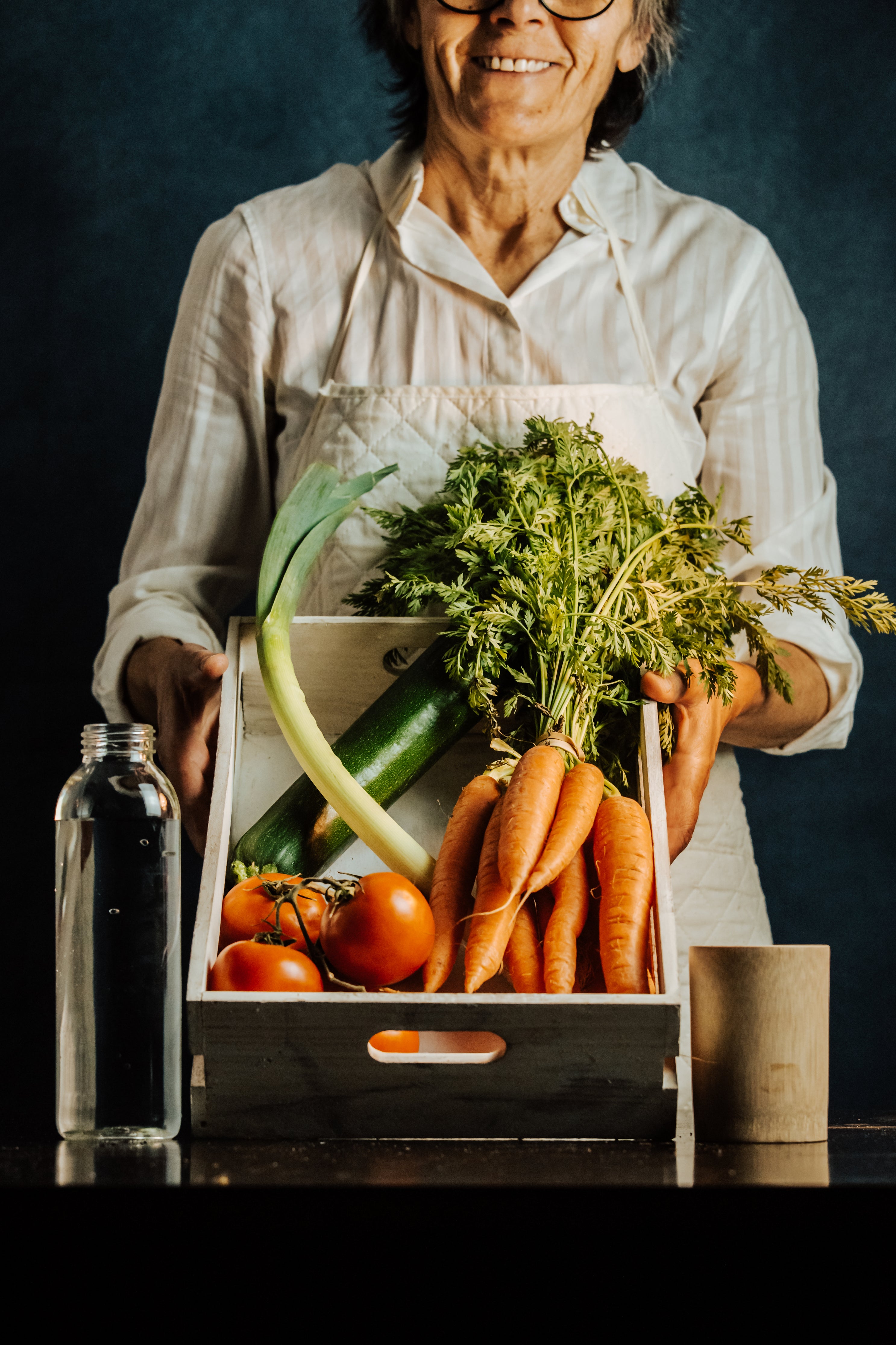 Woman holding a basket of food that may aid in preventing demetia