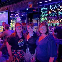 Murphy poses with colleagues at an LGBTQ+ meetup for deathcare professionals