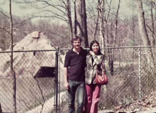 Seal and his wife standing outdoors.