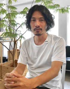 Yamazaki Kentaro seated in his design studio.