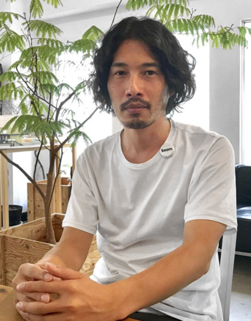 Yamazaki Kentaro seated in his design studio.