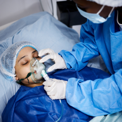 An unresponsive patient is receiving supportive care in a hospital bed